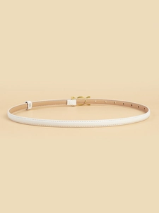 Close-up of white leather slim belt with a gold buckle for women fashion accessories