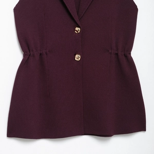 Sleeveless purple knit top with lapel collar, gold buttons and elastic waist design