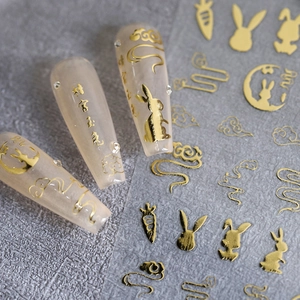 3D gold embossed nail stickers with golden rabbit and cloud patterns for festive nail art