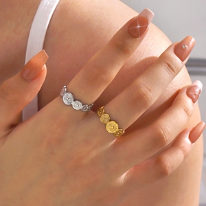Minimalist stainless steel sunflower rings in gold and silver finish on hand