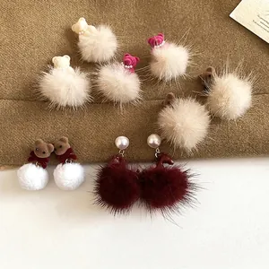 Winter plush bear stud earrings with faux pearl and pom-poms in various warm colors