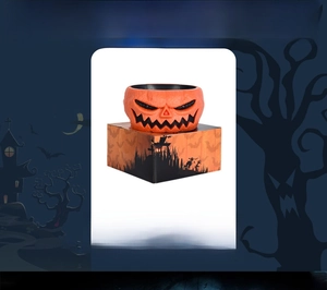 Detail of animated Halloween pumpkin candy bowl with festive packaging box and spooky theme