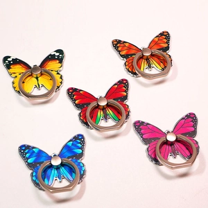 Detailed close-up of 5 colorful butterfly phone ring holders with rose gold metallic grips