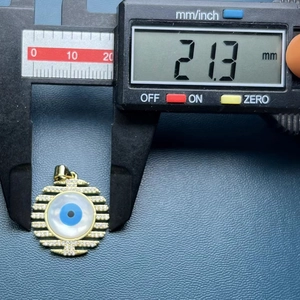 Detailed measurement showing the 21.3mm diameter of this gold evil eye shell pendant