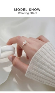 Detailed view of an S925 silver butterfly ring with colorful pavé stones on a finger