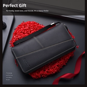 Close-up of black leather long wallet for men with white stitching and gift packaging