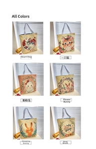 Detail view showing six canvas tote bags with cartoon prints and striped woven handles