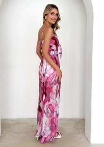 Detail of pink floral jumpsuit showing fine straps and elegant bow knot chest design