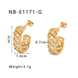 Close-up of gold C-shaped earrings with hollow grid design and micro-inlaid diamonds