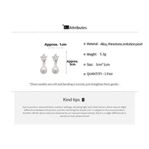 Detailed view of silver tulip earrings with rhinestones and faux pearl measurements