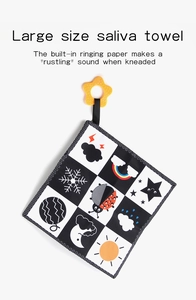 Detailed view of high-contrast black and white baby cloth book with built-in crinkle paper
