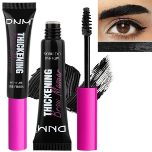 Detail of black fiber brow mascara showing the applicator brush and thickening effect
