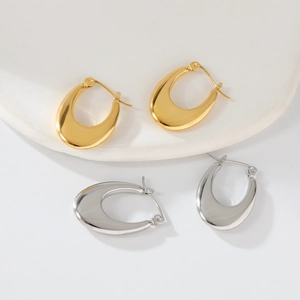 Polished stainless steel irregular star ear hoops in glossy gold and silver finishes