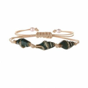 Handmade woven bracelet with green ceramic shell beads and adjustable beige cord