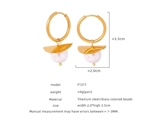 Detail view of gold titanium steel earrings with white glass beads and dimensions