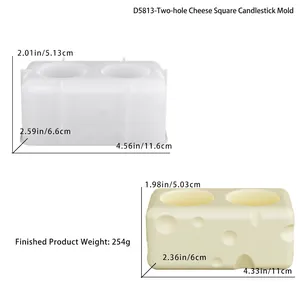 Silicone mold for two-hole cheese shaped candle holder with finished yellow wax product