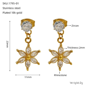 Detailed view of starburst zircon earrings with 18k gold plating and exact measurements