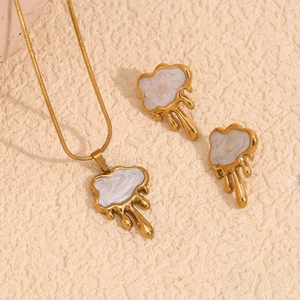 18K gold plated necklace and earring set featuring cloud shapes and white pearl luster