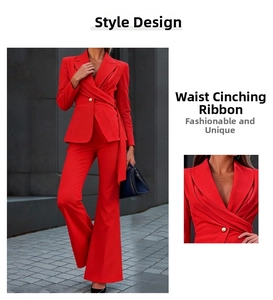 Detail view of red blazer set with waist tie and golden button on structured fabric