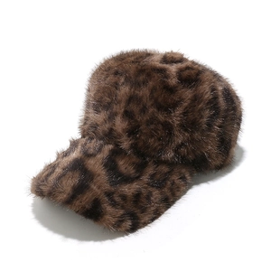 Detail shot of brown leopard print faux fur baseball cap with plush winter texture