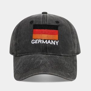 Detailed close-up of Germany flag embroidery on a washed black cotton baseball cap