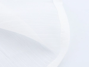 Detailed close-up showing the white mesh fabric texture and neat edge stitching of the dress