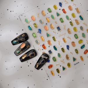 Cosmic starry sky gemstone nail art stickers with gold embossed frames and jewel designs