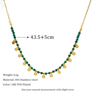 Close-up of natural malachite beads and 18K gold plated stainless steel necklace details