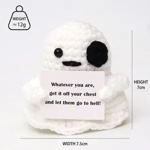 Detail view of handmade crochet ghost plush holding a card, 7cm high and 7.5cm wide