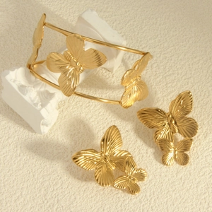Golden titanium steel butterfly bracelet and earrings set with 18k gold plating details