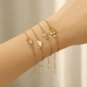 Elegant 4-piece gold chain bracelet set with elephant, cloud, plane and heart lock charms