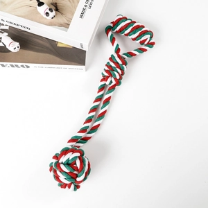 Detailed close-up of a red, green, and white braided cotton rope dog chew toy