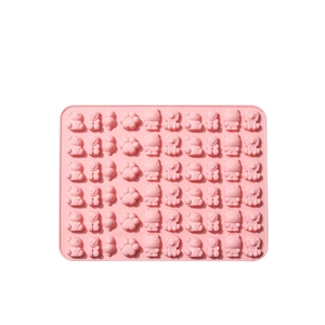 Pink animal-shaped silicone gummy mold for chocolate and candy making with animal patterns
