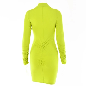 Rear view of tight-fitting fluorescent green mini dress with ruched details on back and sleeves