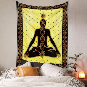 Detail of meditation tapestry with seven chakras on a yellow background in a bedroom