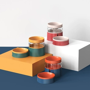 Set of multi-color elevated pet feeding bowls with glass inserts and plastic bases