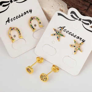 Golden stud earring set featuring colorful cubic zirconia in star and geometric shapes