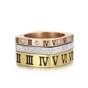 Three-piece stainless steel ring set with Roman numerals and diamond-set accents