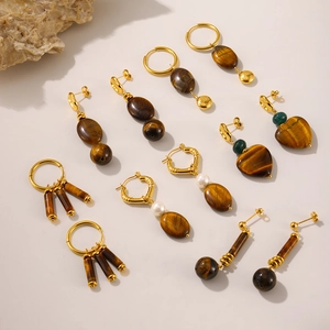 Tiger eye stone and 18k gold plated stainless steel earring set on cream background