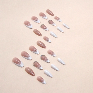 Glitter French press-on nails in almond shape with white lines and rhinestone accents