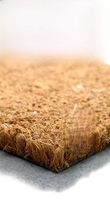 Detail showing 1.5cm thick natural coir fiber texture and durable black rubber edging