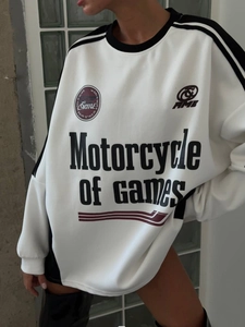 Close-up of white crewneck sweatshirt with black letter prints and drop shoulder design