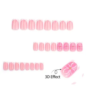 Short square press-on nails with 3D flower design and pink gradient French tip finish