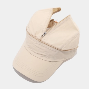 Detail of detachable zipper design on beige quick-dry baseball cap for ponytail