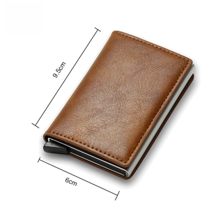 Detail view of brown leather RFID blocking wallet showing compact size 9.5cm x 6cm