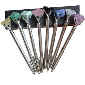 Silver metal ballpoint pens set with colorful raw crystal stones on black box