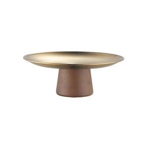 Detailed view of round brass metal plate on a conical reddish-brown wood pedestal base