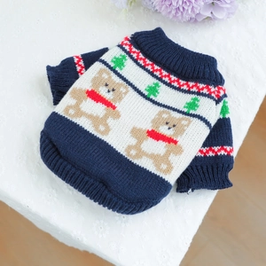 Detail of warm knitted pet sweater featuring a brown bear pattern and ribbed textures