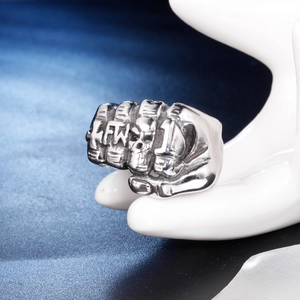Silver skull fist punk ring made of durable stainless steel shown on a hand model