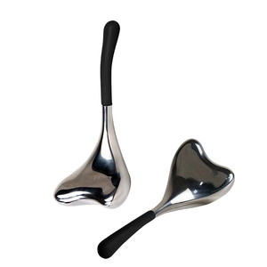 Pair of stainless steel mermaid ice globes with black handles for cooling facial massage